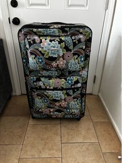 Large, blue and brown flowers suite case.