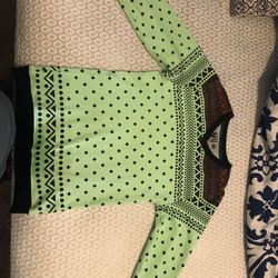 Nice green sweater with patterns. New condition worn about once or twice