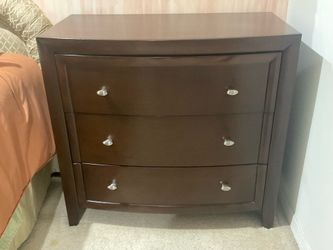 Wood dresser with three large drawers. Dark brown,  excellent condition.