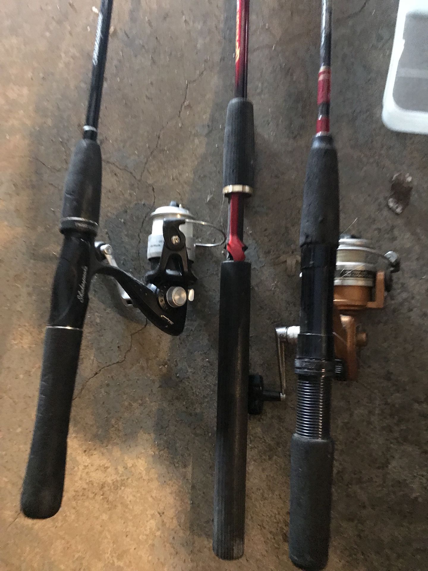 Fishing poles in reel and tackle box