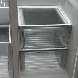 The Frigidaire FRSS2623 25.6 cu. ft. Side-by-Side Refrigerator with Dispenser