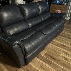 Navy Blue Leather Reclining Couch Barely Used Retails For $2200