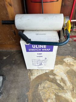 Shrink wrap dispenser and 4 rolls of shrink wrap