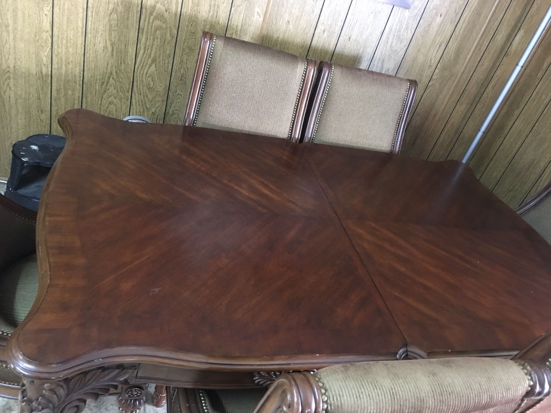 Solid wood dining table with six chairs and two extended if you want to make it bigger