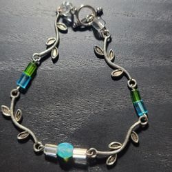 Handmade Bracelet In Blue And Green With A Pretty Leaf Vine Design 