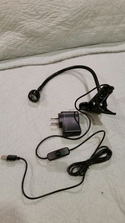 Flexible clip-on desk lamp.