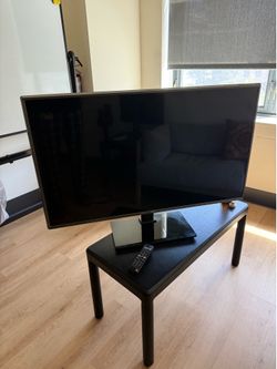 Flat Screen 55” TV w/ Stand