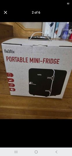 Mini fridge includes car and home adapter. New in box