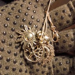 Charm necklace with few charms in perfect condition