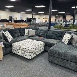 New Charcoal Gray Sectional $1699. Ottoman $299 More. Delivery & Set Up Available 