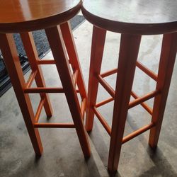Two Orange Bar Stools