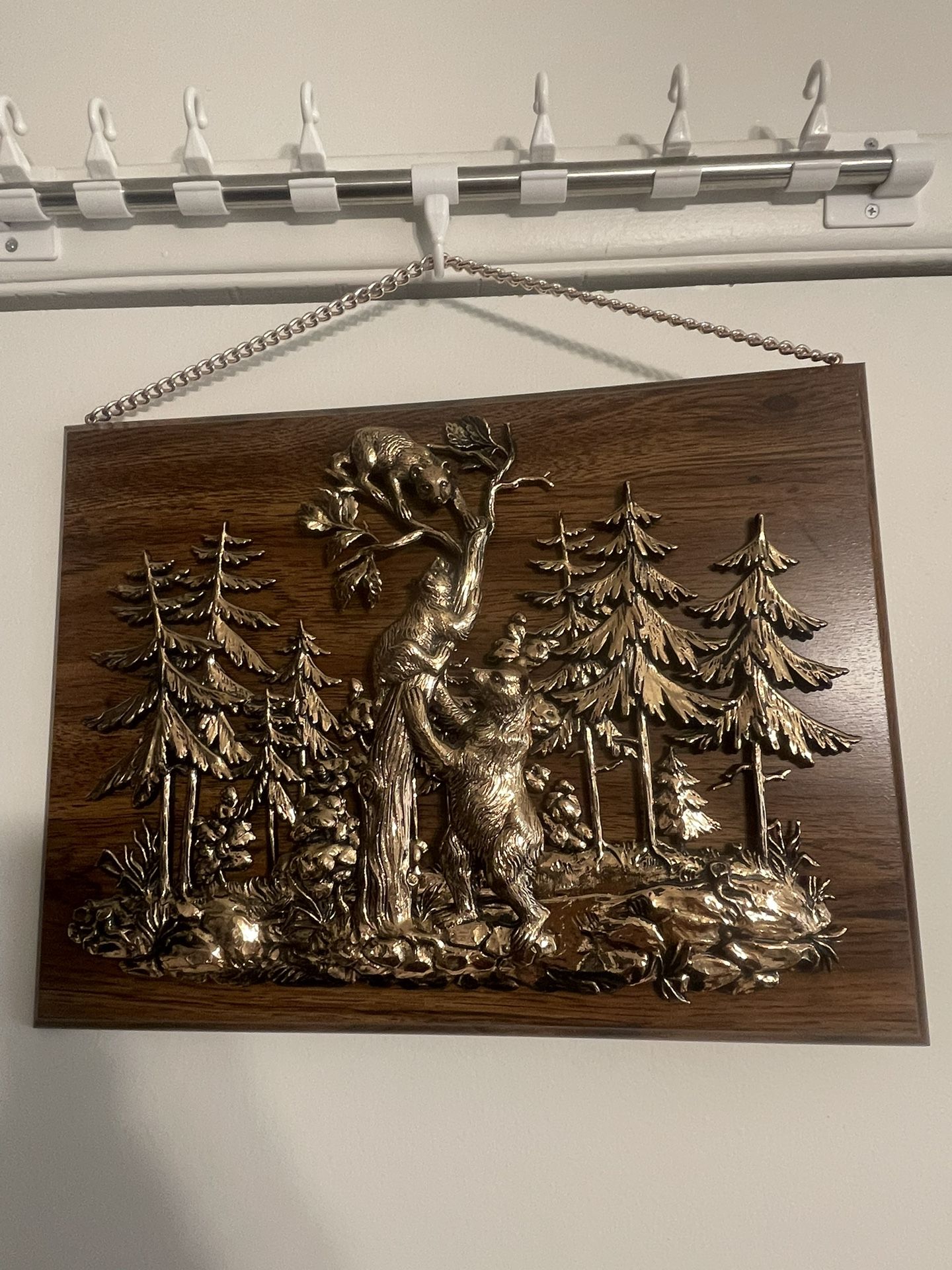 vintage A&F wall hanging featuring a 3D copper-toned metal plaque