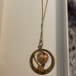 10 kt black hills gold pendant and 14 kt necklace