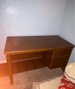 Wooden office desk with drawers
