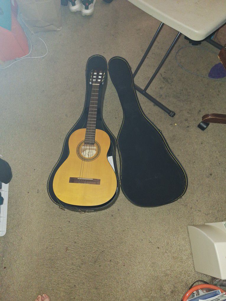 Acoustic Guitar With Case And Two Music Instructions