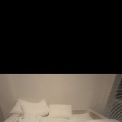 White 120” modular cloud-style sofa. 3-seater with ottoman that has storage