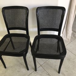 Two Black Cane Chairs 