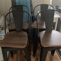 Four metal and wood bar stools