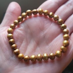Natural Pearl Bracelet .This is a golden baroque pearl stretch bracelet. 