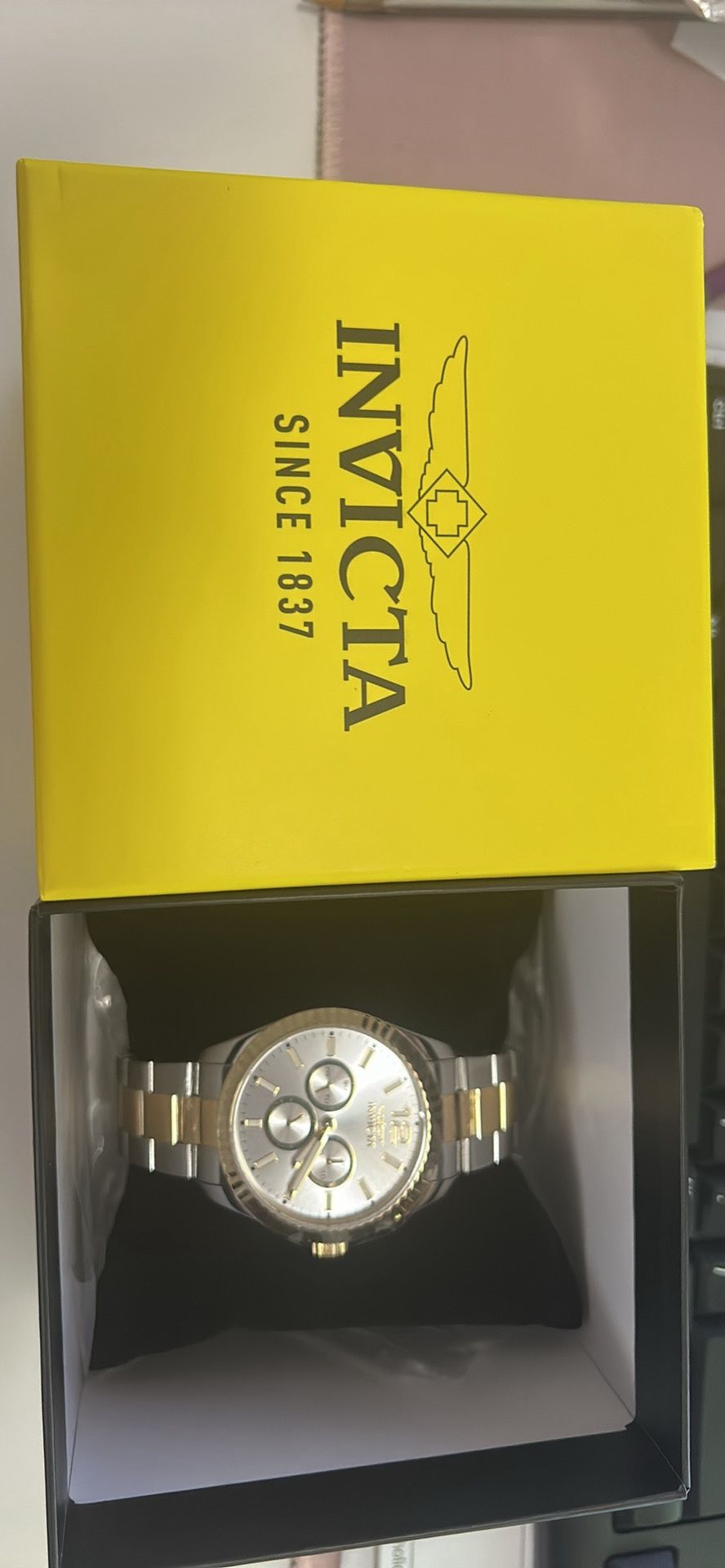 Invicta Specialty 29373 men's watch with a silver-tone dial and a two-tone stainless steel