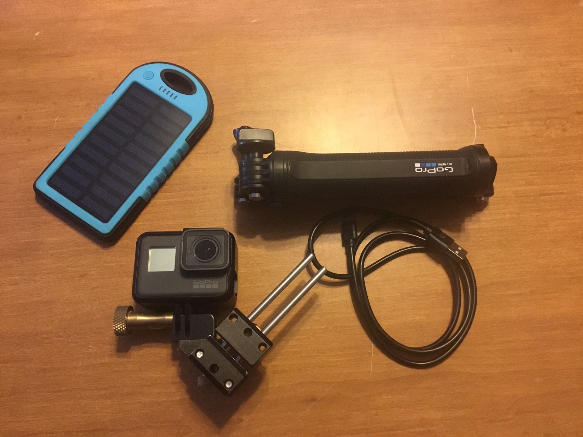 GoPro 5 Hero Black, with cables, tripod, and battery pack to charge if needed