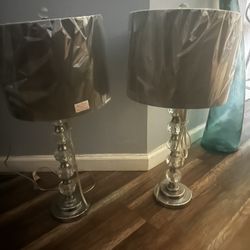 A Pair Of Lamps With Gray Shades
