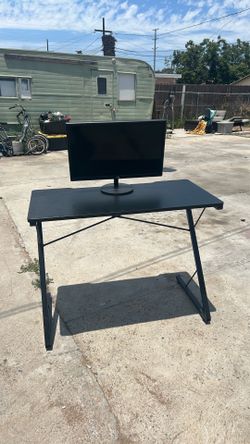 A carbon fiber desk with monitor