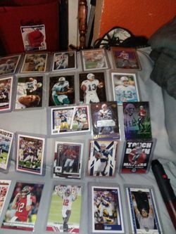 There's Ten Dan Marino's,Also 14 Tom Bradys 1 Kobe Bryant Rookie Card And Also 2 LeBron James