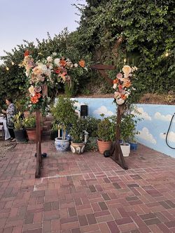 Wooden arch with artificial flowers