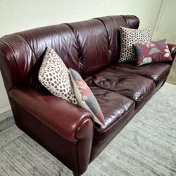 Large leather burgundy couch/sofa with pillows 