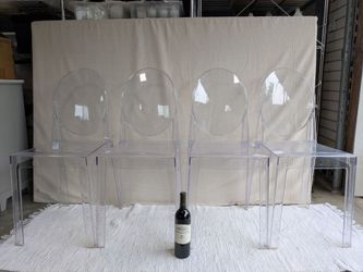 (4) Modern acrylic / plastic clear dining chairs suitable for indoor / outdoor use