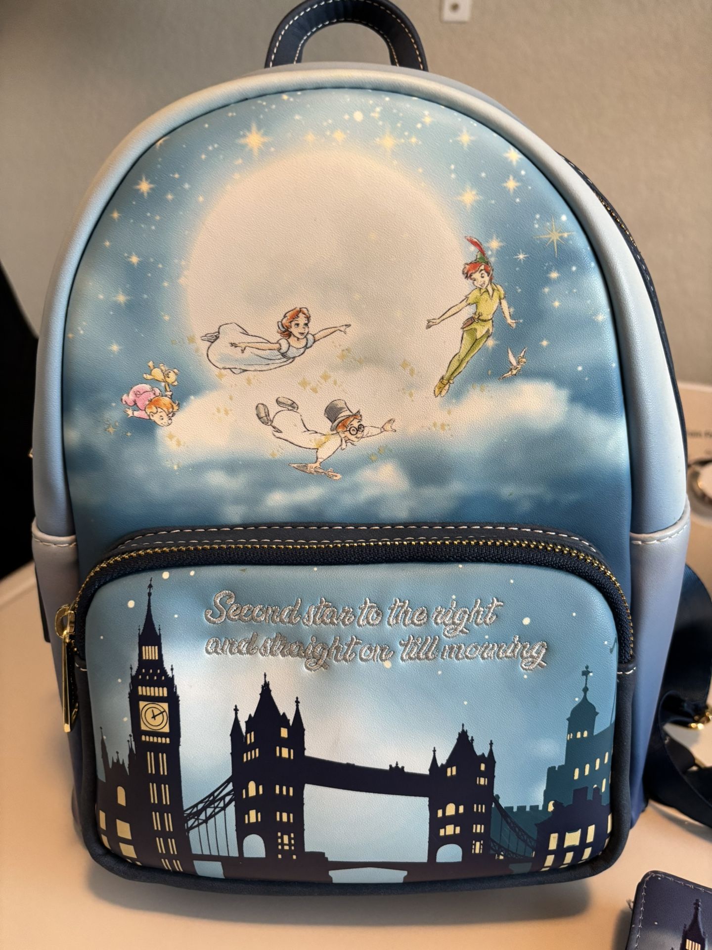 Peter Pan Loungefly backpack and matching wallet