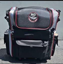 Rolling fishing tackle bag with rod holders
