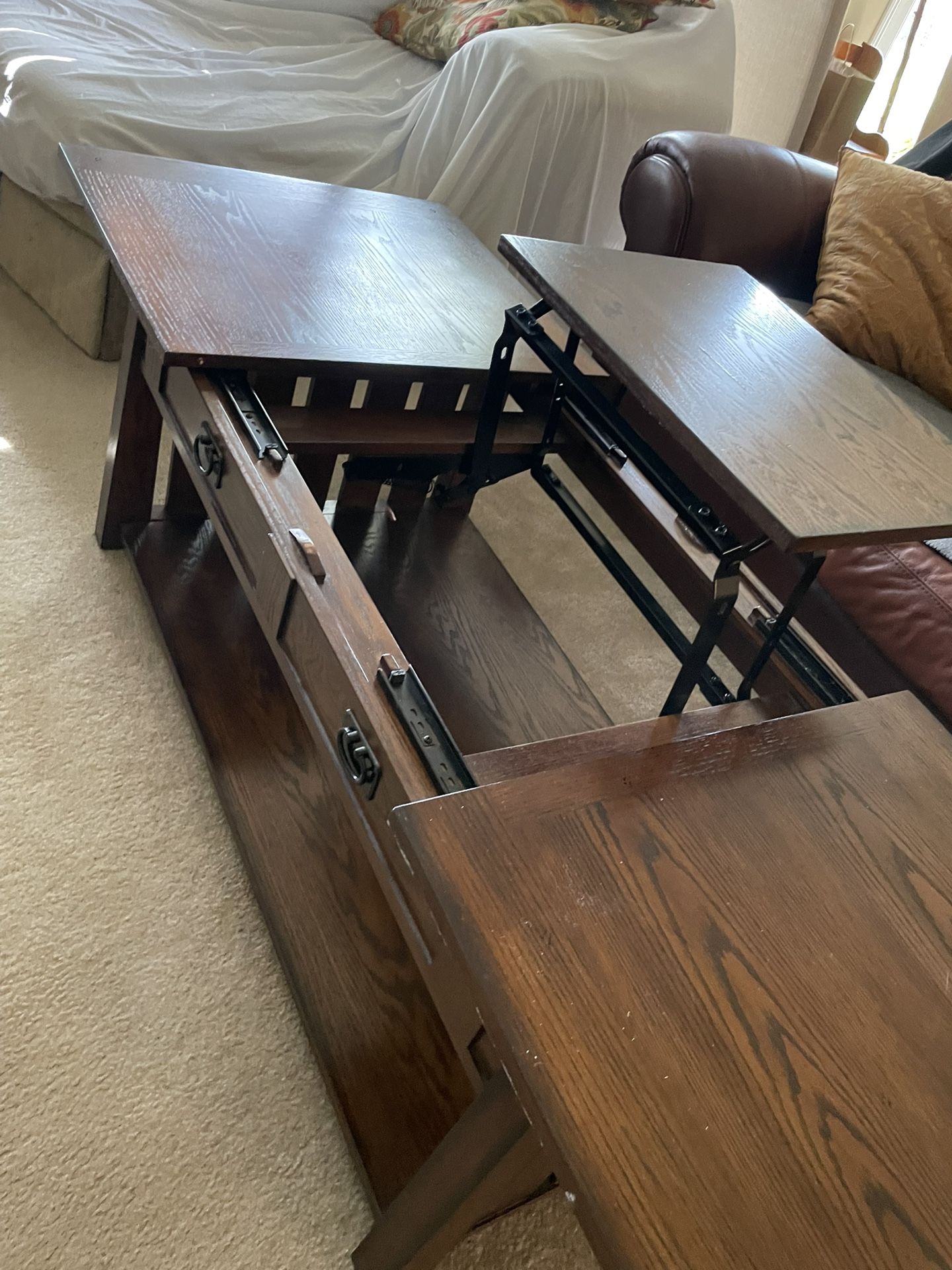 For pick up in Wintergarden Florida, sturdy quality shaker style coffee table with smooth opening that reveals a work area table that lifts up has a b