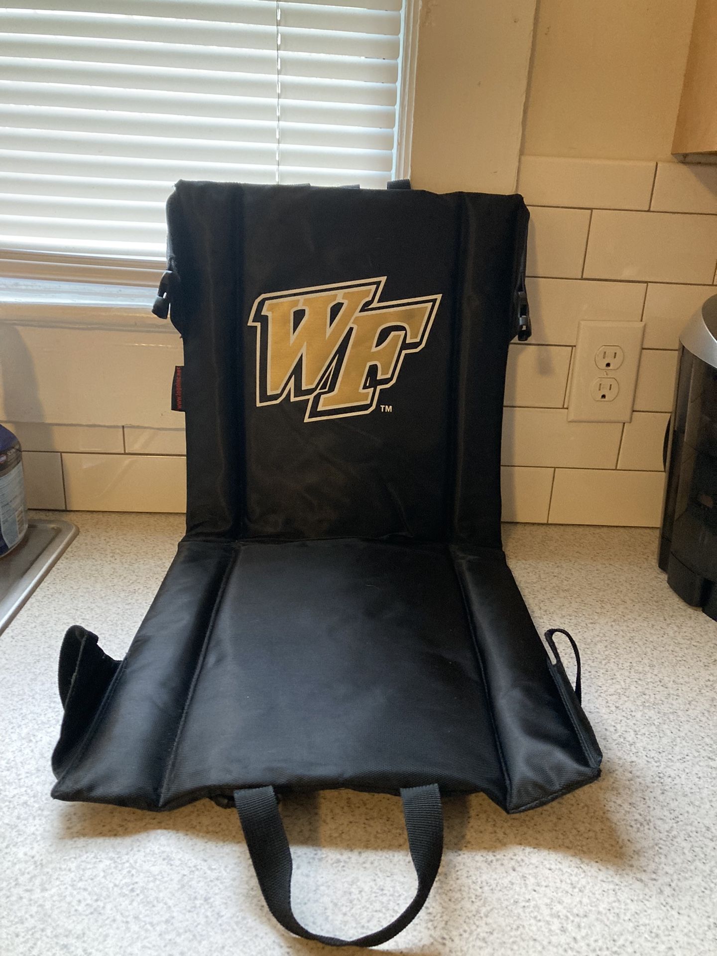 NEW WAKE FOREST STADIUM SEAT WITH CARRYING STRAP ASKING $25 - COMPARE TO $38.00 AT WALMART 