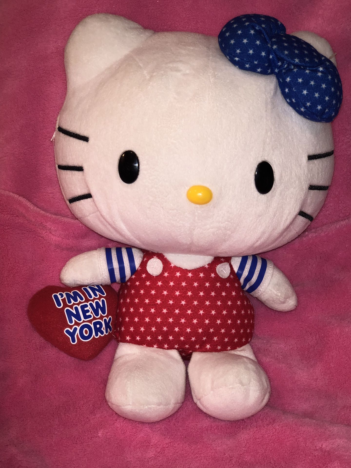 Large 11” Hello Kitty New York plush doll wearing star overalls and matching star bow