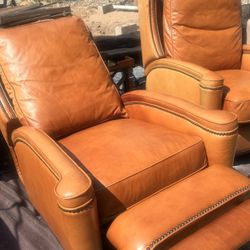 This is a Hooker Furniture leather recliner featuring a distinct nailhead trim.