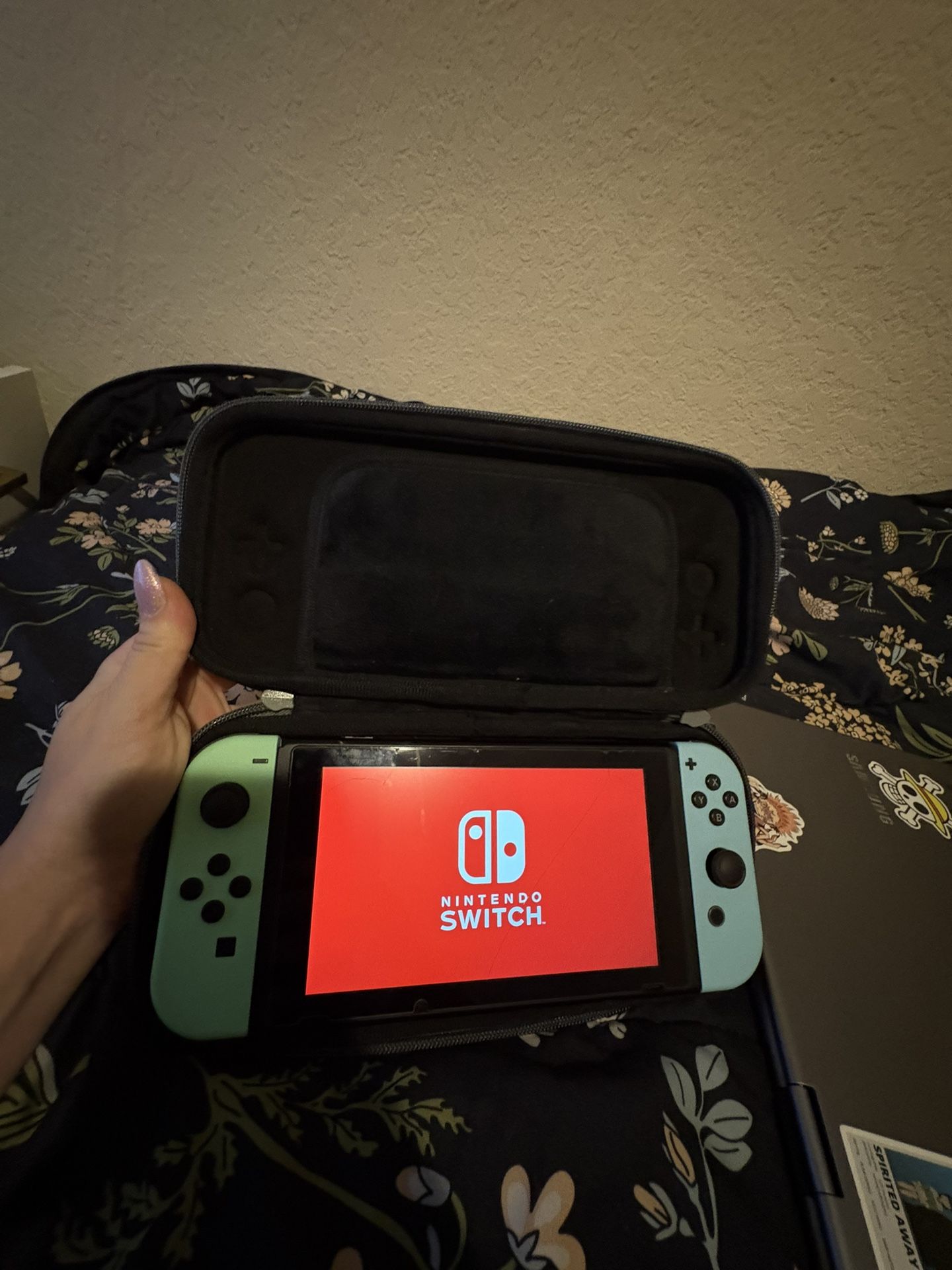 Nintendo Switch console with protective case and four games included - console only, needs dock