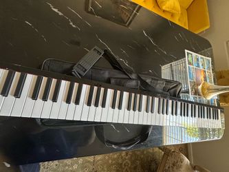Full-size keyboard, 88 keys, foldable with a travel case