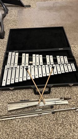 Xylophone in hard case and notes stand