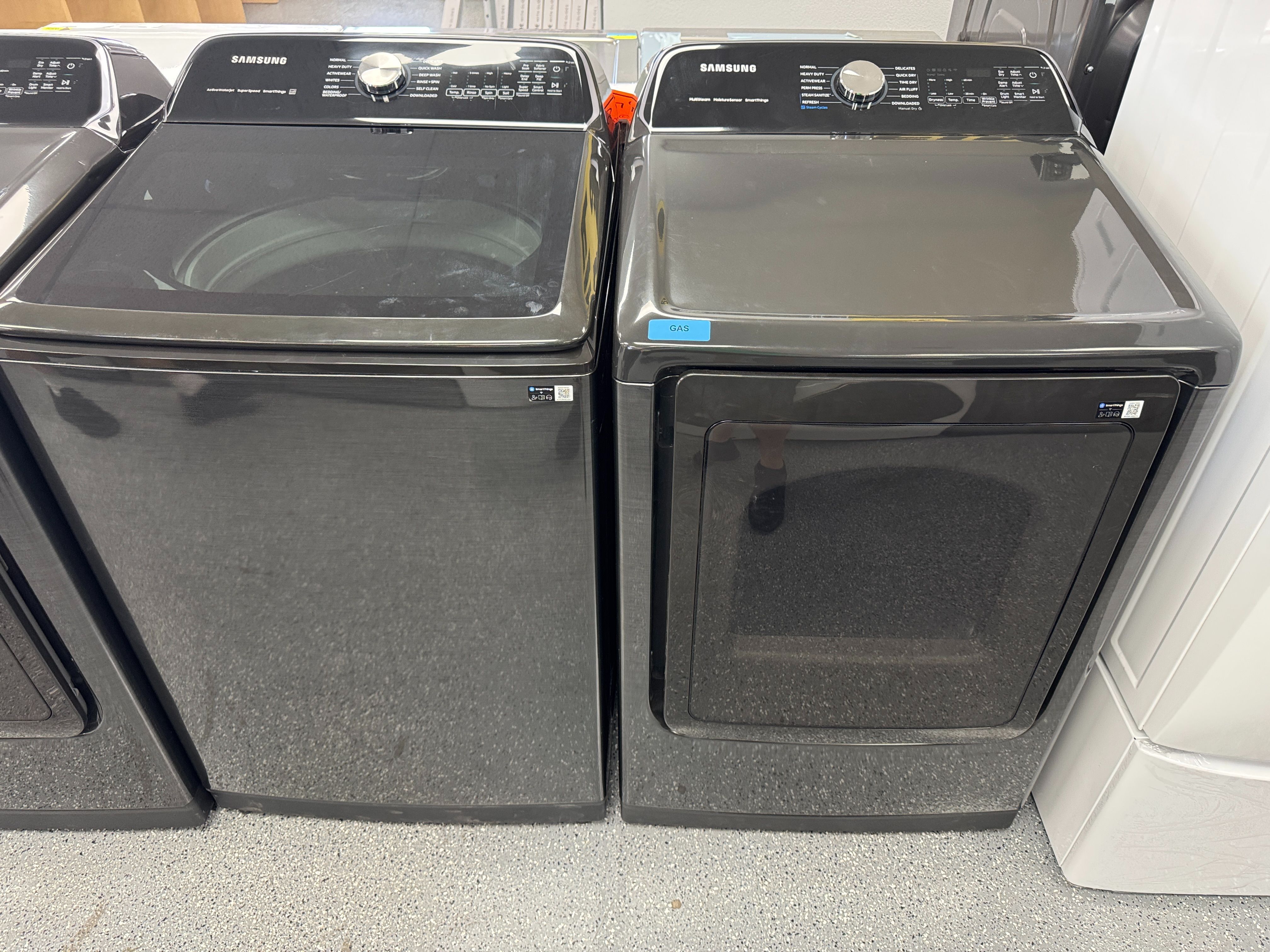 Black Samsung Washer 5.5 cu ft and 7.4 cu ft Gas Dryer Set. Units are new open box scratch and dent