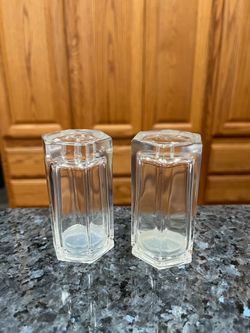 Vintage Clear Tempered Glass pair of  salt and pepper shakers.  Shape  hexagon.  Size approximately 4 inches tall.  Nice sturdy weight.