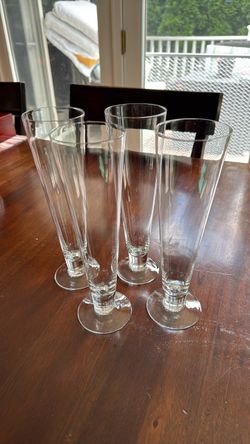 Vintage" footed crystal pilsner beer glass with a slender tapered bowl and clear round foot