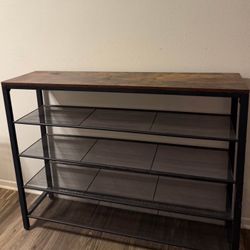 The perfect shoe organizer  metal shelves, I used it as a shoe rack/entry table  
