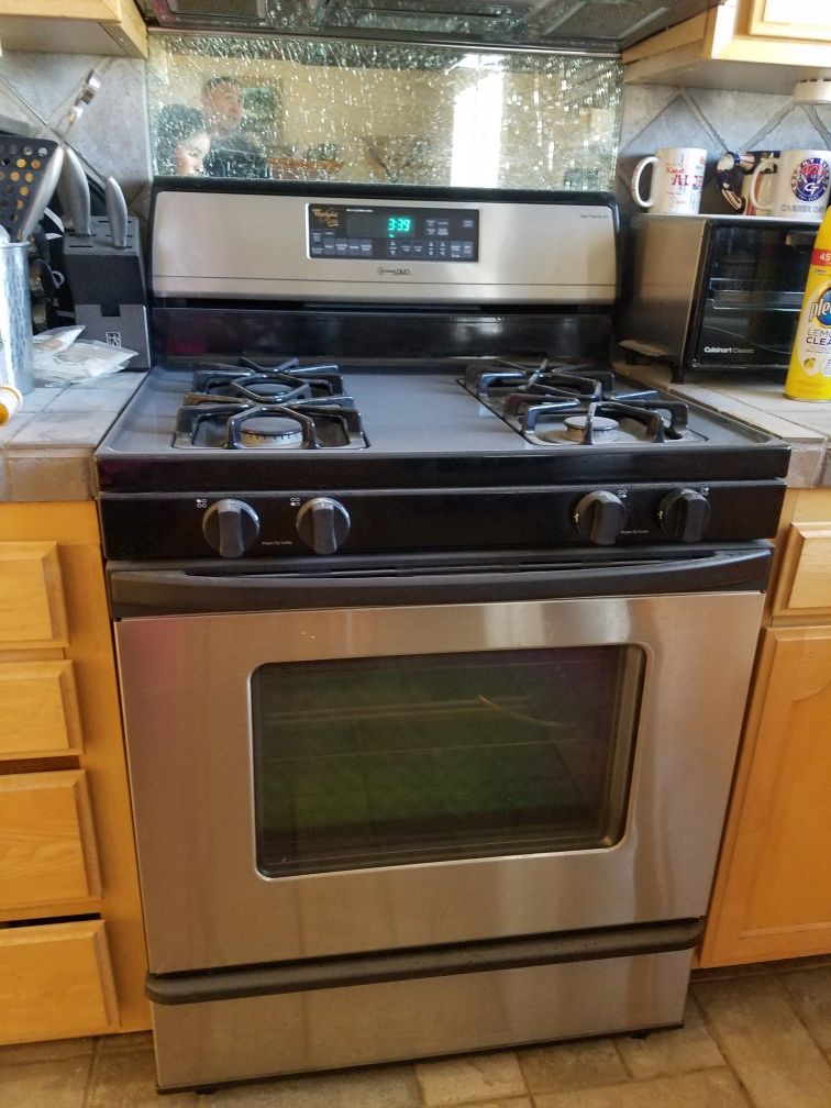 Kitchen appliances (stove, microwave, dishwasher & refrigerator)