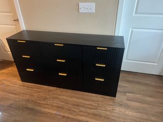 Black dresser with gold handles