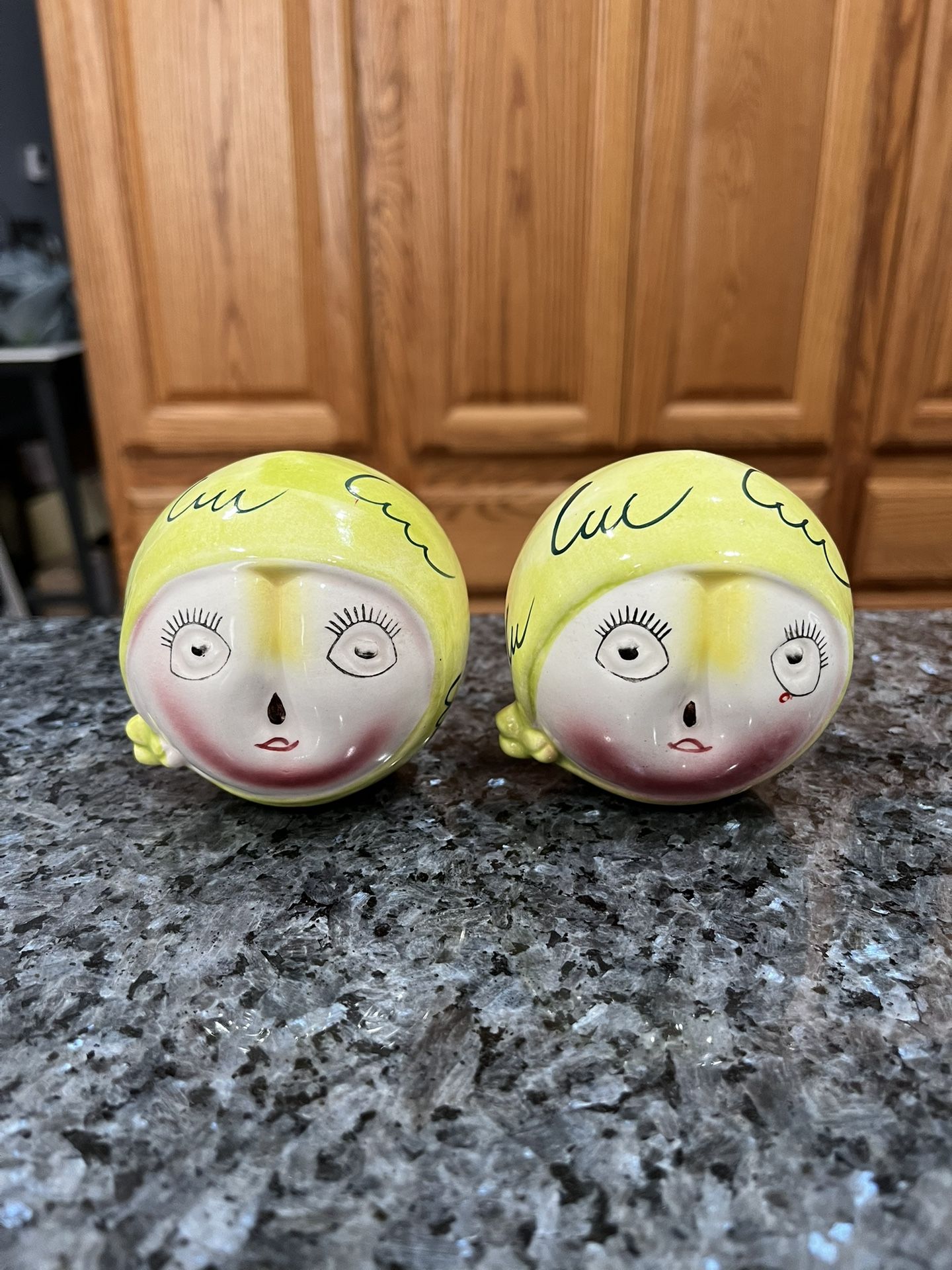 Vintage 1950s Peach Head Anthropomorphic pair of Salt and Pepper Shakers. The bottom has Japan stamped on it. Also on the bottom is the name and da
