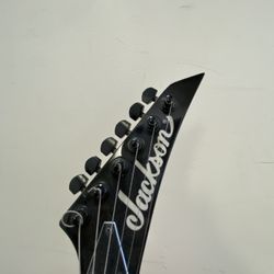 Jackson JS Series Dinky Minion JS1X electric guitar in Neon Pink. 