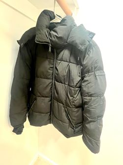 Puffy jacket with a hood.