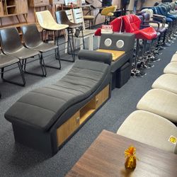 Massage Lounge Has Massager  In It Storage And Table And Speakers 